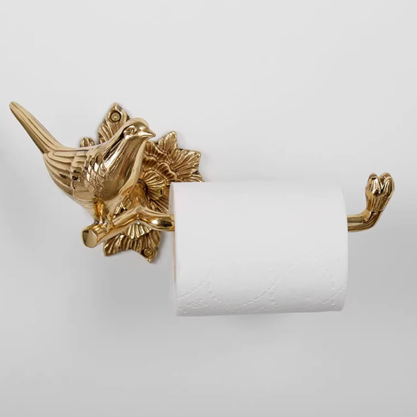 Brass bird toilet paper holder with ornate detail, part of the Brass Bird Bathroom Set.